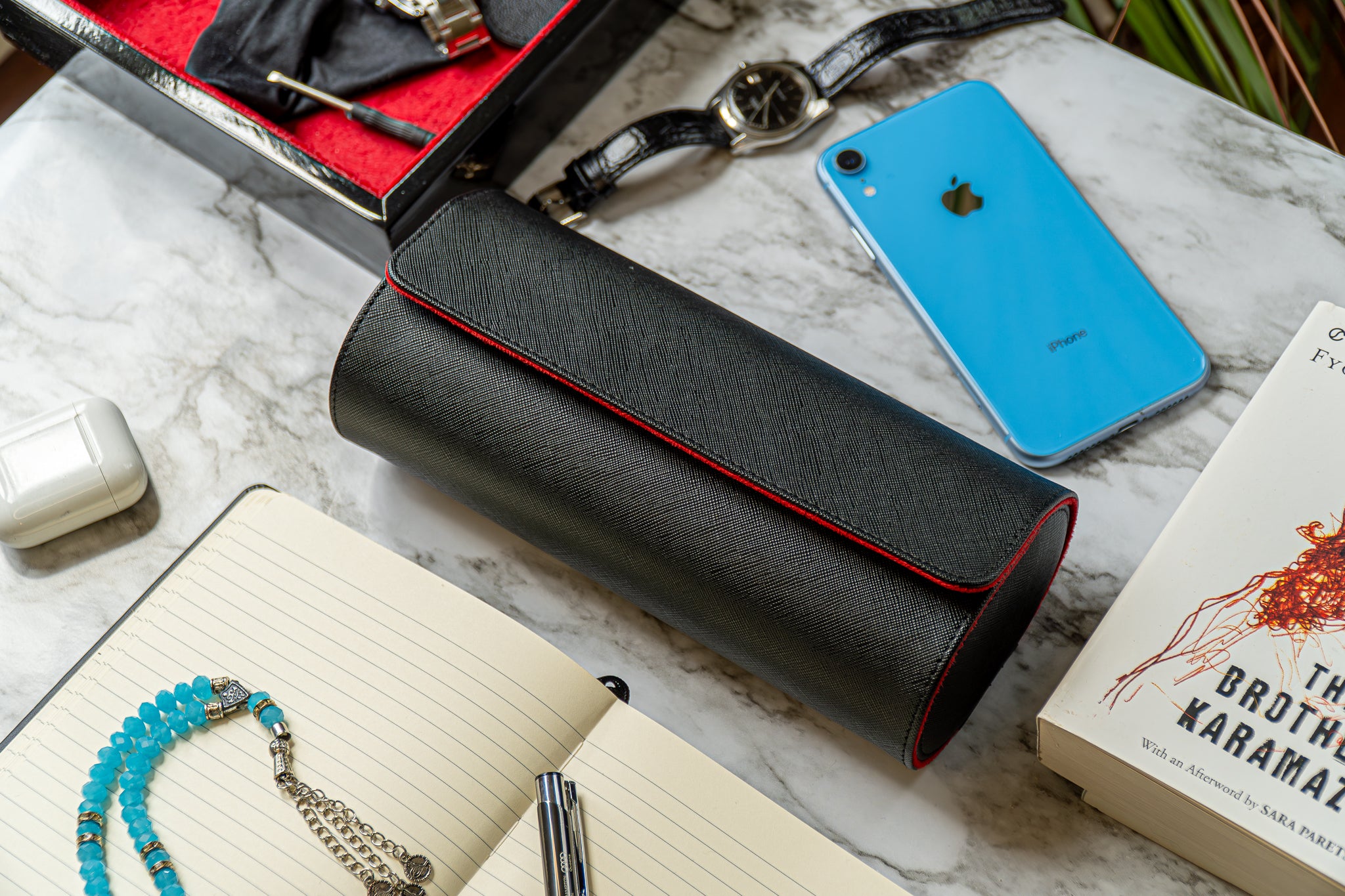 Elevate your watch storage game with this exquisite personalized red and black leather watch roll and watch case, accented with stylish black stitching. Crafted for travel, it's a portable watch organizer perfect for dad, mom, boyfriend, girlfriend, or any watch enthusiast in your life. Personalize it for a thoughtful gift on birthdays, anniversaries, Father's Day gift, Mother's Day gift, Christmas gift, or any special occasion. With space for three watches, keep timepieces safe and secure on the move