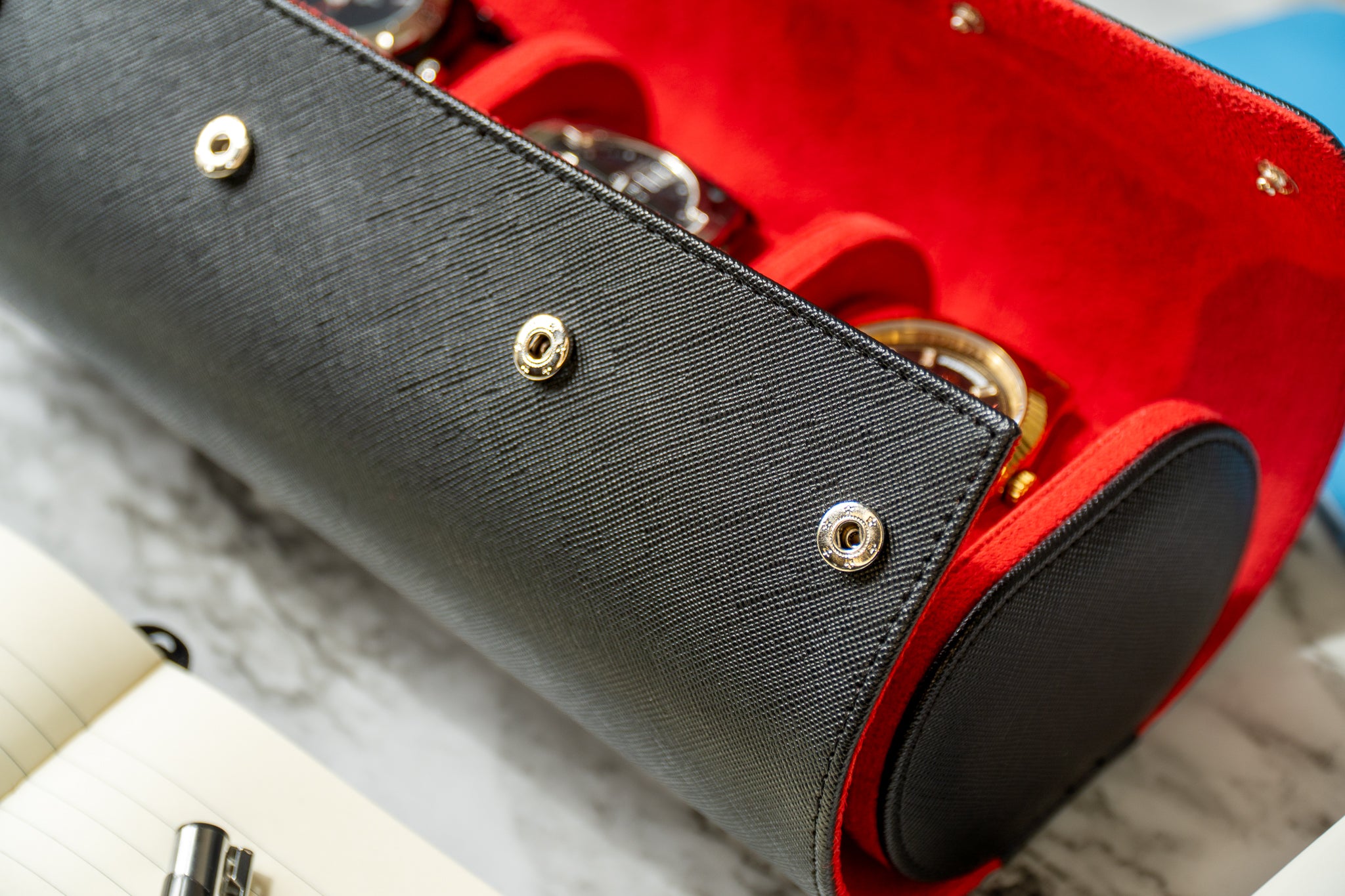 Elevate your watch storage game with this exquisite personalized red and black leather watch roll and watch case, accented with stylish black stitching. Crafted for travel, it's a portable watch organizer perfect for dad, mom, boyfriend, girlfriend, or any watch enthusiast in your life. Personalize it for a thoughtful gift on birthdays, anniversaries, Father's Day gift, Mother's Day gift, Christmas gift, or any special occasion. With space for three watches, keep timepieces safe and secure on the move