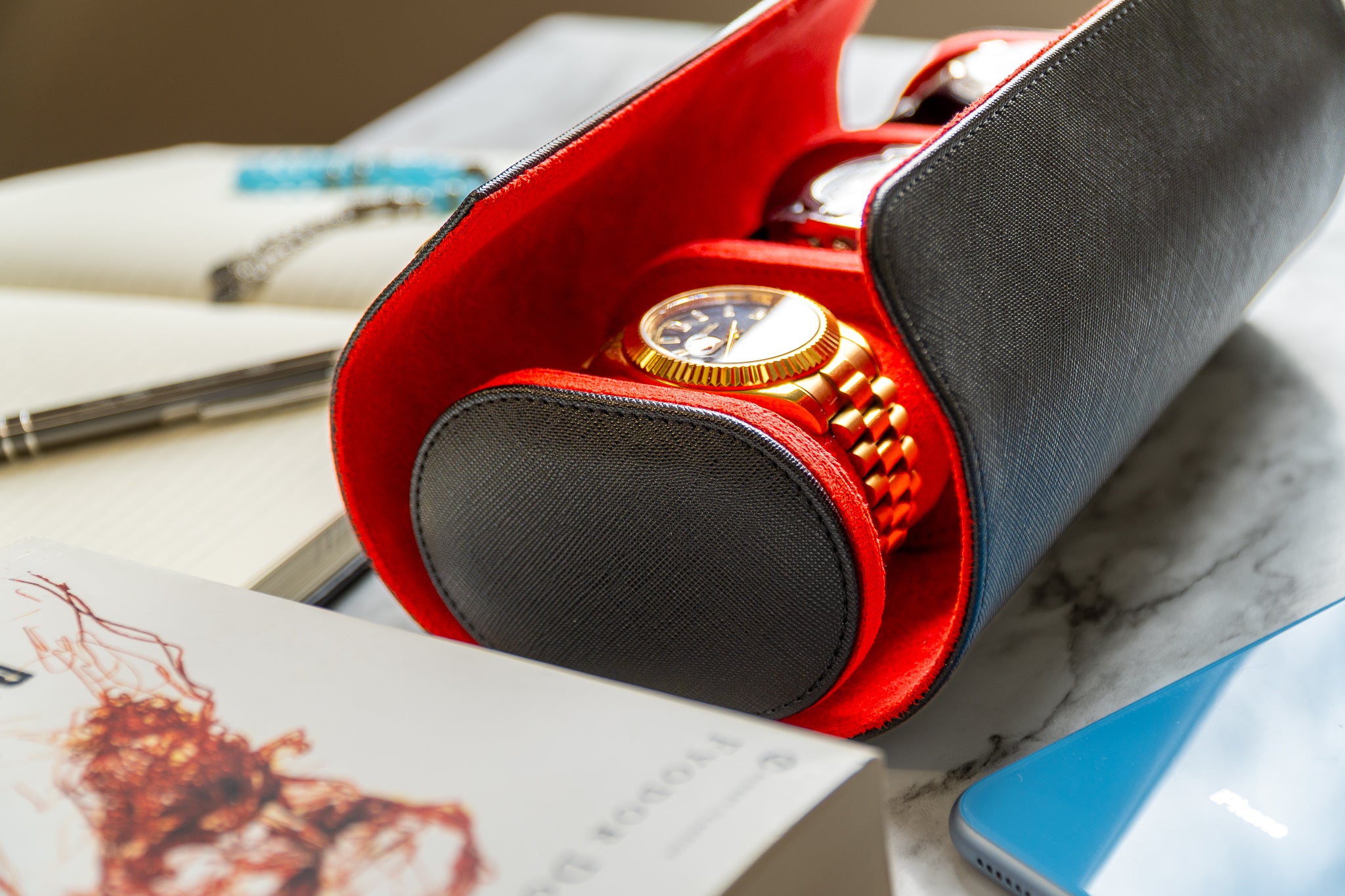 Elevate your watch storage game with this exquisite personalized red and black leather watch roll and watch case, accented with stylish black stitching. Crafted for travel, it's a portable watch organizer perfect for dad, mom, boyfriend, girlfriend, or any watch enthusiast in your life. Personalize it for a thoughtful gift on birthdays, anniversaries, Father's Day gift, Mother's Day gift, Christmas gift, or any special occasion. With space for three watches, keep timepieces safe and secure on the move