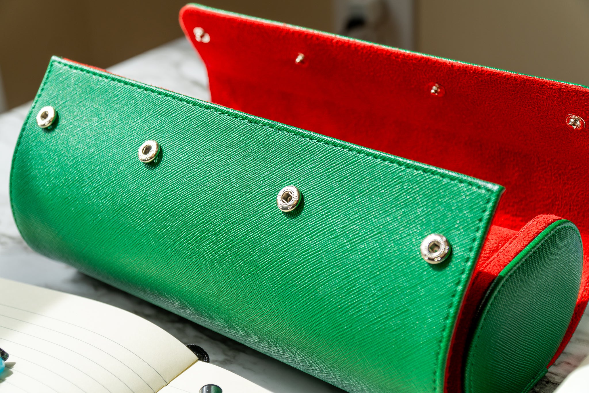 Elevate your watch storage game with this exquisite personalized green/red leather watch roll and watch case, accented with stylish green stitching. Crafted for travel, it's a portable watch organizer perfect for dad, mom, boyfriend, girlfriend, or any watch enthusiast in your life. Personalize it for a thoughtful gift on birthdays, anniversaries, Father's Day gift, Mother's Day gift, Christmas gift, or any special occasion. With space for three watches, keep timepieces safe and secure on the move