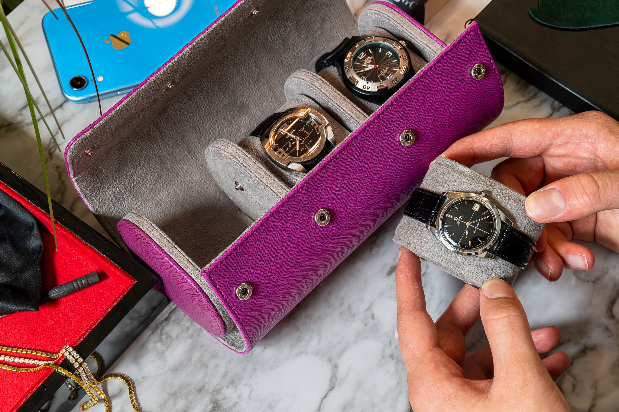 Elevate your watch storage game with this exquisite personalized purple and gray leather watch roll and watch case, accented with stylish purple stitching. Crafted for travel, it's a portable watch organizer perfect for dad, mom, boyfriend, girlfriend, or any watch enthusiast in your life. Personalize it for a thoughtful gift on birthdays, anniversaries, Father's Day gift, Mother's Day gift, Christmas gift, or any special occasion. With space for three watches, keep timepieces safe and secure on the move