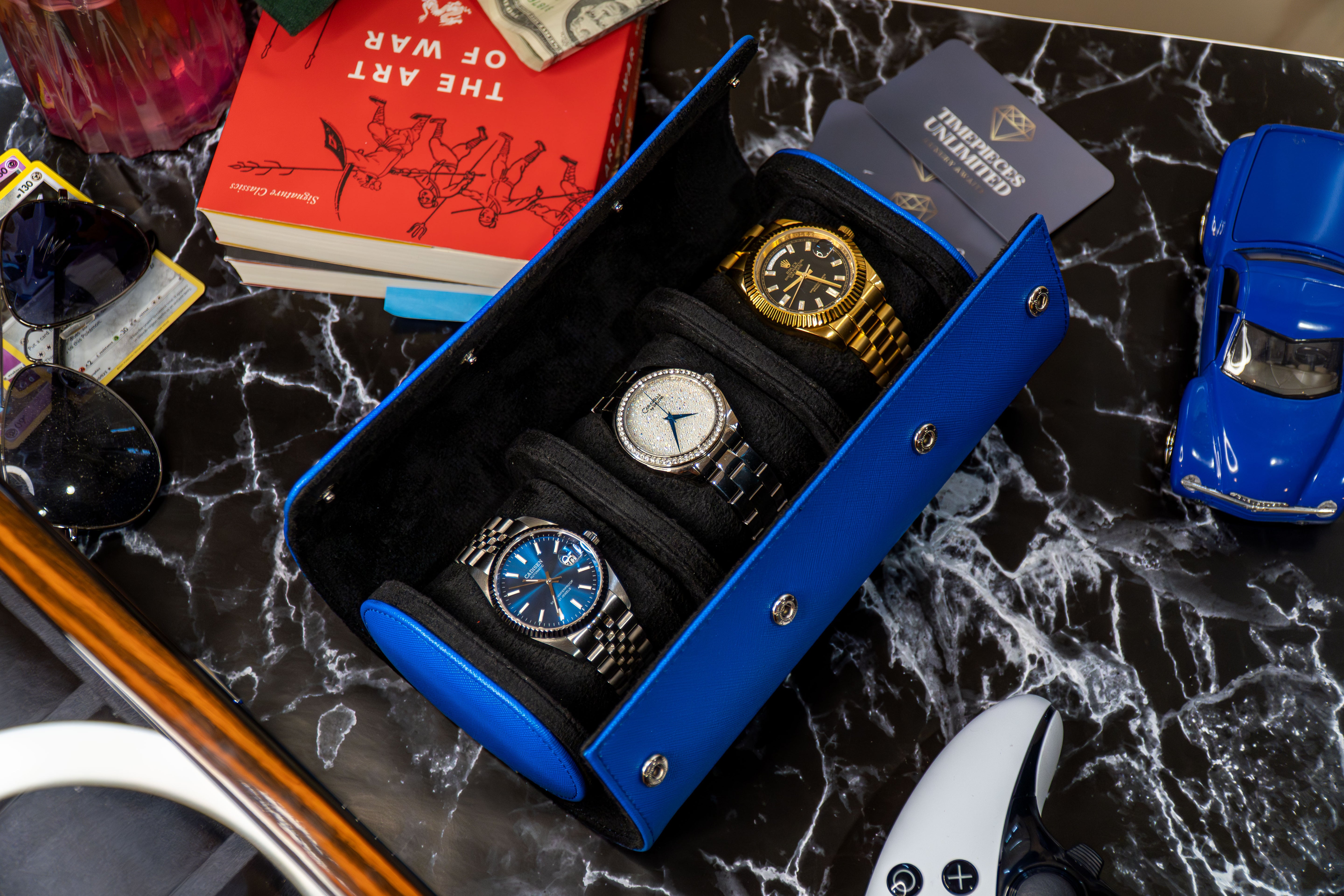 Elevate your watch storage game with this exquisite personalized blue leather watch roll and watch case, accented with stylish blue stitching. Crafted for travel, it's a portable watch organizer perfect for dad, mom, boyfriend, girlfriend, or any watch enthusiast in your life. Personalize it for a thoughtful gift on birthdays, anniversaries, Father's Day gift, Mother's Day gift, Christmas gift, or any special occasion. With space for three watches, keep timepieces safe and secure on the move